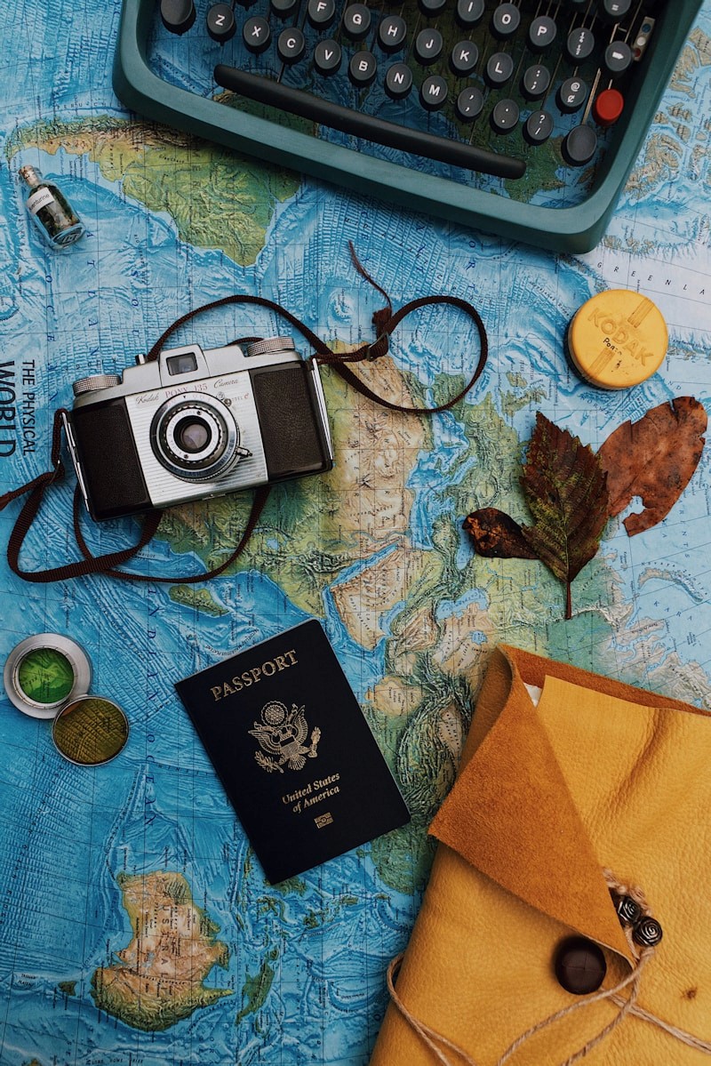 Passport and laptop flat lay